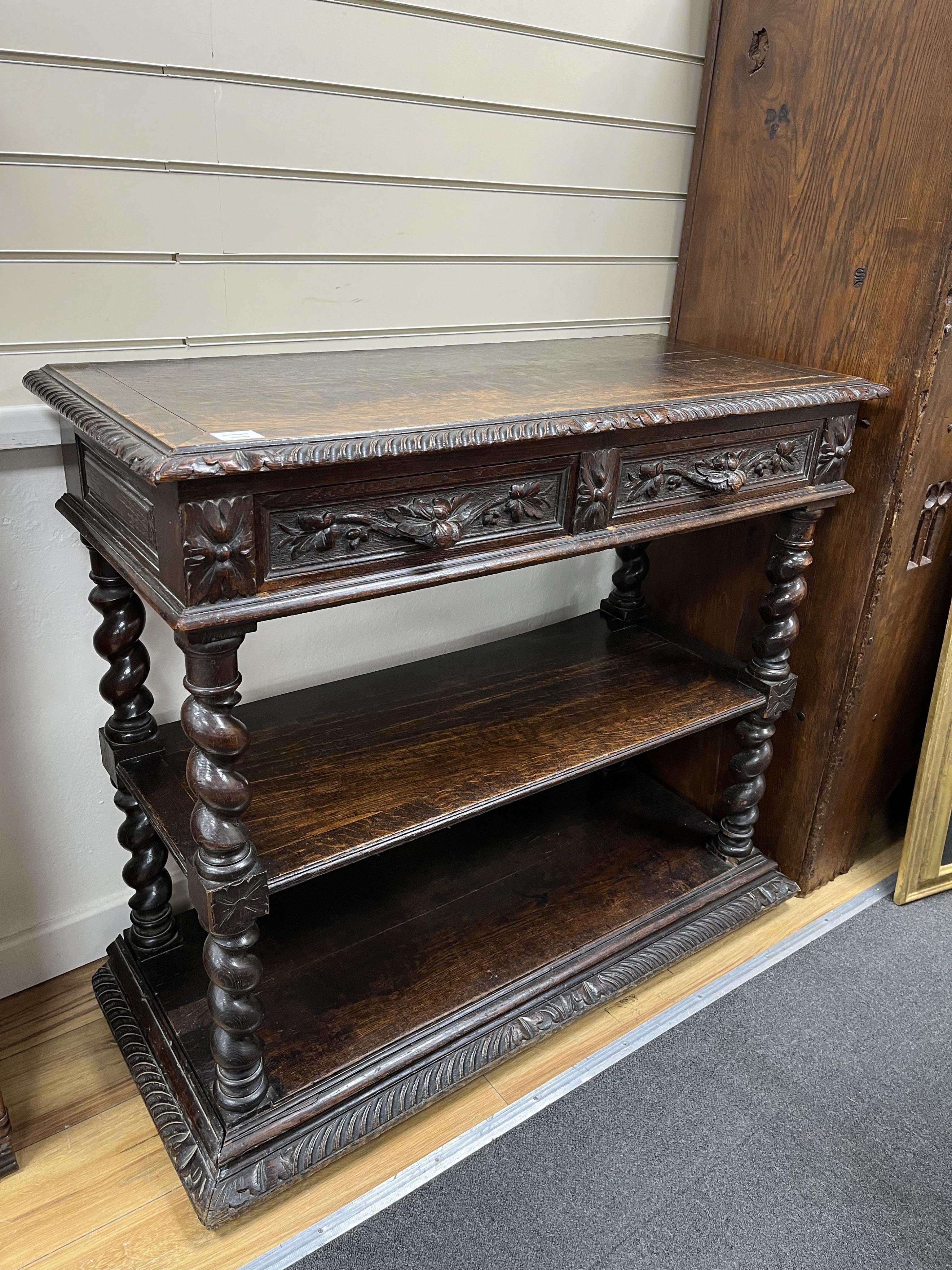 A late 19th century Flemish carved oak buffet, width 105cm, depth 44cm, height 93cm. Condition - fair